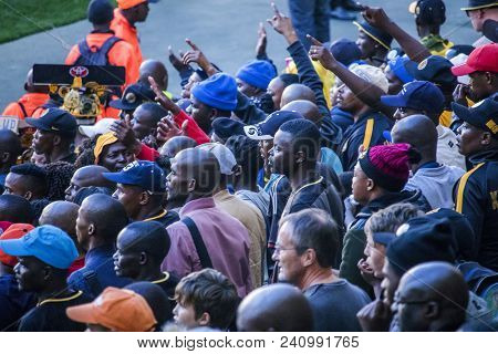 Cape Town, South Africa, 12 May 2018 - Diverse South African Football Supporters Arguing With A Deci
