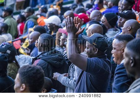 Cape Town, South Africa, 12 May 2018 - Diverse South African Football Supporters Cheering And Celebr