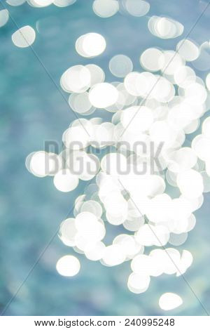 Colorful Twinkling Beach Reflect Bokeh Light Background.