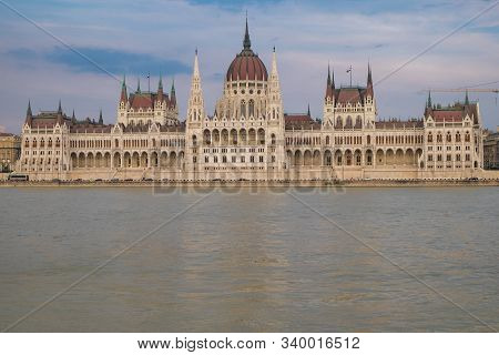 View Of Historical Building Of Hungarian Parliament On Danube River In Budapest, Hungary, Europe.