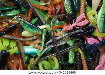 Pile Of Rubber Bait Background For Design In Your Work Concept.