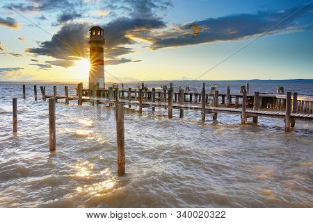 Popular Lighthouse At Lake Neusiedl See During Sunset. Podersdorf At The Lake Is Town In District Of