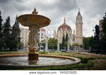 Church of San Manuel y San Benito and fountain viewed from El Retiro Park in Madrid, Spain.