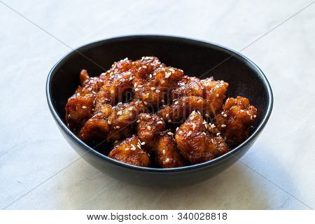 Asian Food Homemade Chinese General Tsos Chicken With Sesame Seeds Served With Chopsticks.