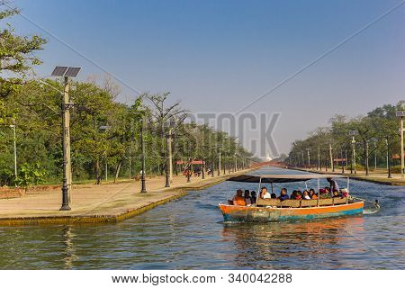 Lumbini, Nepal - November 09, 2019: Tourists In A Motorboat On The Canal Of The Mayadevi Temple In L
