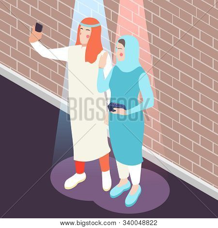 Modern Young Saudi Arabian Couple In Traditional Muslim Clothing Taking Selfie With Smartphone Isome