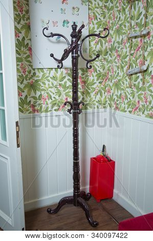 Hat Stand Silhouette . Floor Hanger . Stand Stick Hanger, Close-up. Iron Gilded Rarity Clothes Hange