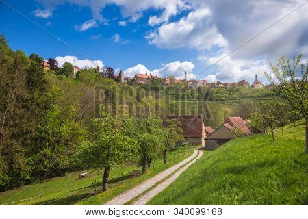 Scenic skyline of Rothenburg ob der Tauber, Bavaria, Germany, Europe, one of the most popular travel destination on Romantic Road touristic route as seen from the Tauber river valley