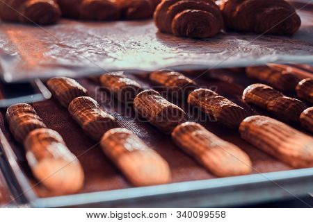 Fresh Cookies With Chocolate Are Ready To Be Removed From The Oven At Bakery Shop.