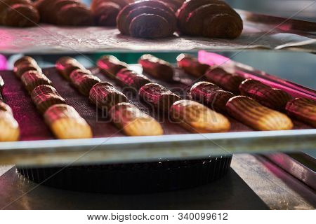 Fresh Cookies With Chocolate Are Ready To Be Removed From The Oven At Bakery Shop.