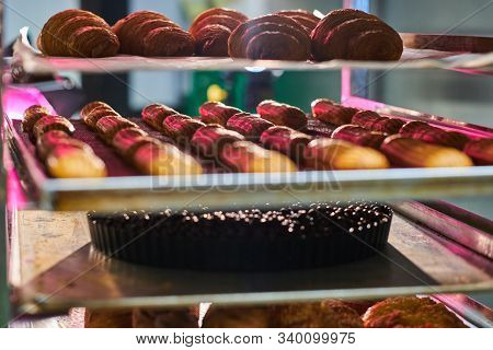 Fresh Cookies With Chocolate Are Ready To Be Removed From The Oven At Bakery Shop.