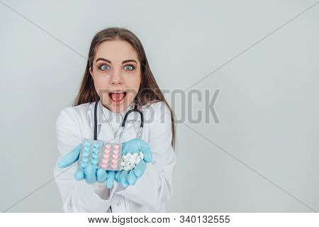 Closeup Portrait Of Young Female Intern Showing Her Palms Full Of Different Pills, Looking Crazily, 