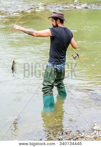 Always Hooked Up Fishing. Summer Weekend. Big Game Fishing. Mature Man Fly Fishing. Man Catching Fis