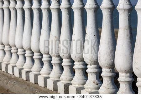 White, Decorative Fence With Concrete Balusters. Antique Fence.
