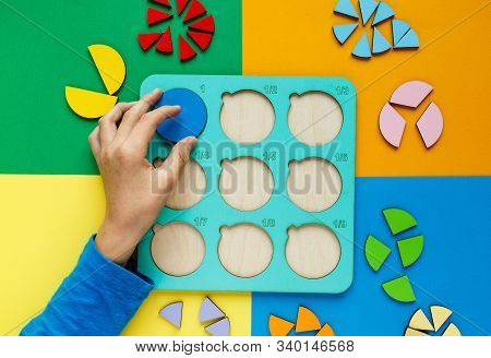 Wooden Kids Toys On Colourful Paper. Educational Fractions. Toys For  Kindergarten, Preschool Or Day