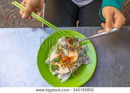 Woman Eating Vietnamese Popular Steamed Rice Roll- Banh Cuon