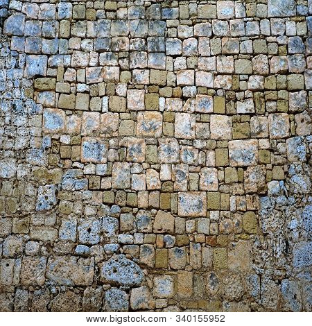 Old Stone Brick Wall Green And Blue Rockwork With No Mortar In The Crevices.  Cool Texture Backgroun