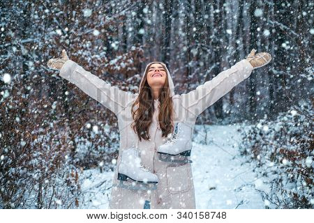 People In Snow. Beauty Winter Girl In Frosty Winter Park. Outdoor Close Up Portrait Of Young Beautif