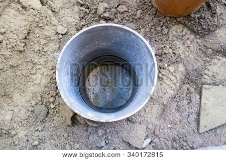 Behind A Large Building There Is A Drain Well Of Waste Water