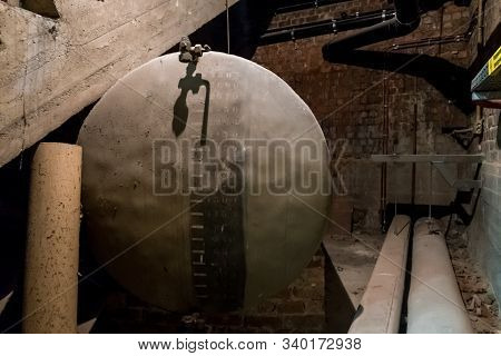 In A Separate Room In A Old Building, There Is A Heating Oil Tank