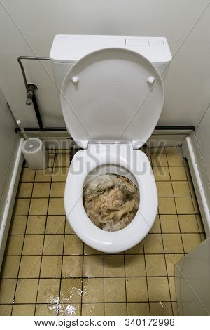 This Toilet For The Ladies Is Clogged, Too Much Toilet Paper Has Been Used