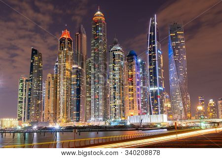 Dubai Skyline At Night With Lights On The Water And Luxirious Skyscrapers Of Uae, Travel Destination