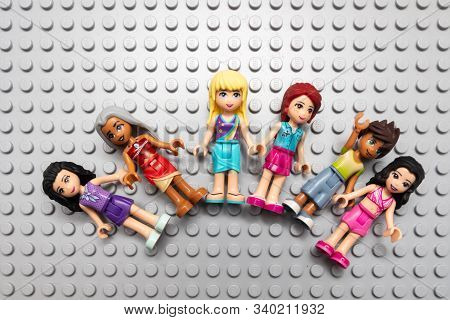 Kouvola, Finland - 18 December 2019: Lego Friends Minifigures On Gray Baseplate