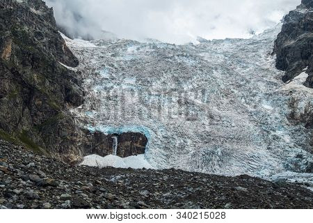 Amazing View To Full Adishi Glacier Icefall And Its Small Waterfall In Mountains Of Svaneti Georgia
