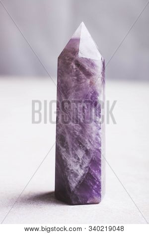 Amethyst Mineral Stone On A White Background. The Concept Of Meditation.