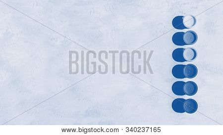 Blue Color Background. Colorful Glass Beads Pattern. Paints In Round Jars And Brush On A Gray Concre