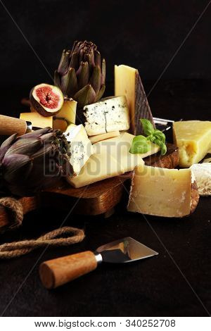 Different Sorts Of Cheese. Cheese Platter With Different Cheese And Spice