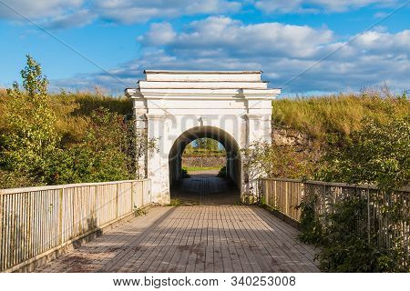 Ravelin Gate Between Stone Walls And Wooden Bridge In Sunny Day, Annenkrone, Vyborg, Leningrad Oblas