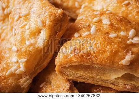 Freshly Prepared Puff Pastry With Sesame Seeds Close-up. Macro Photograph Of A Cookie Texture. Home 