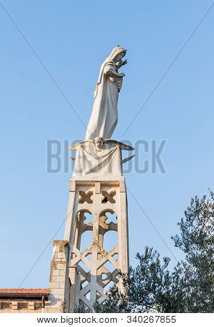 Jerusalem, Israel, December 07, 2019 : Statue Of The Mother Of God With A Baby In Her Arms On The Ro