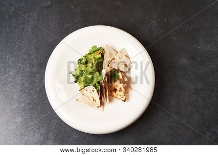 Guacamole With Pita Chips On White Plate. Chef's Signature Dish