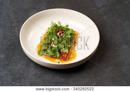 Smashed Cucumbers Plate With Red Chili Pepper Garlic Parsley And Vegetable Oil