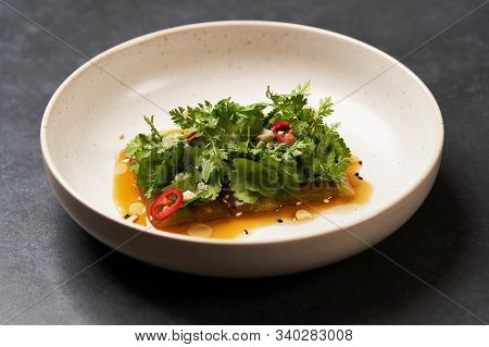 Smashed Cucumbers Plate With Red Chili Pepper Garlic Parsley And Vegetable Oil