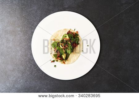 Mexican Tacos With Beef, Tomatoes, Avocado, Chilli And Onion