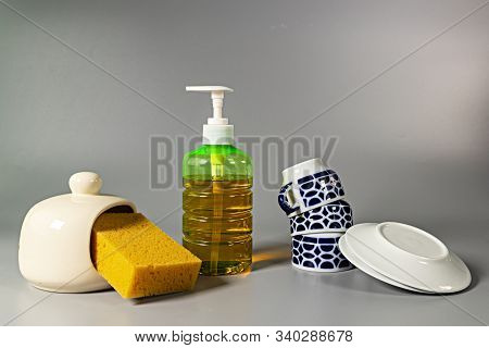 Sponge, Detergent, Cups And Dishes For Washing