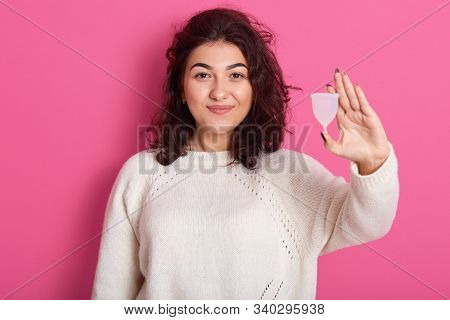 Image Of Confident Charming Brunette Standing Isolated Over Pink Background In Studio, Holding Mentr