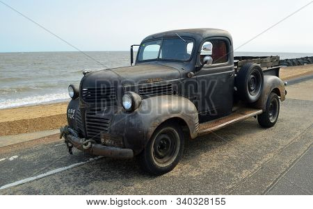 Felixstowe, Suffolk, England - August 29, 2015:  Rusty Classic Dodge Piick Up Truck  Parked On Seafr