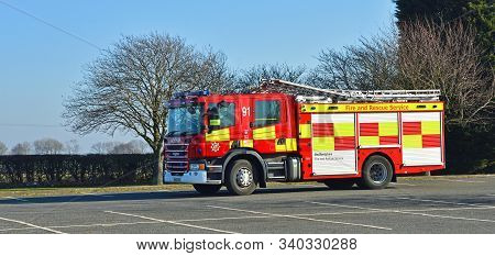 Grafham, Cambridgeshire, England - February 15, 2019: Scania Modern Fire Englne Being Driven  On Tar