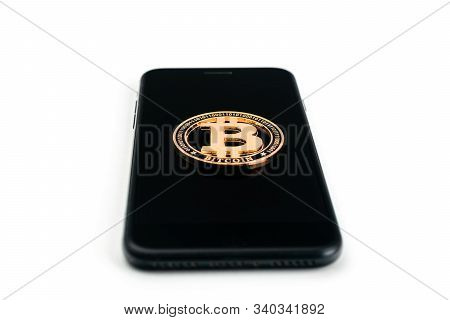 Bit Coin. Gold Cryptocurrency, Black Smartphone Isolated On White Background. Litecoin, Ethereum Cry