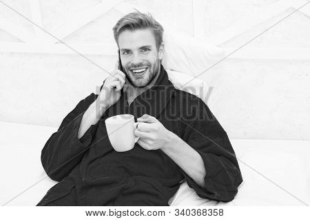 Hipster Guy Pajamas Bathrobe Freelance Worker Relaxing At Home. Remote Work Concept. Glad To Hear. M