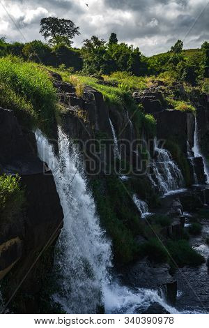 Amazing Pongour Waterfall In Vietnam, Da Lat With The Buddha On The Top.travel Concept ,wonderful Vi