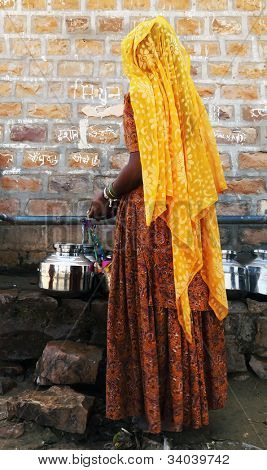 Indian woman waiting at a water source in Thar Desert, India