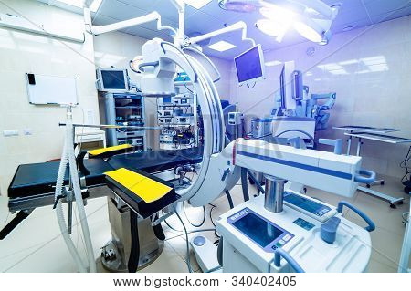 Modern Equipment In Operating Room. Medical Devices For Neurosurgery. Background. Interior With X-ra