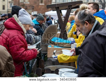 Cracow, Poland - December 15, 2019: Christmas Eve For Poor And Homeless On The Main Square In Cracow