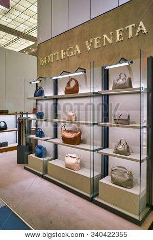 BERLIN, GERMANY - CIRCA SEPTEMBER, 2019: Bottega Veneta bags on display at the Kaufhaus des Westens (KaDeWe) department store in Berlin.