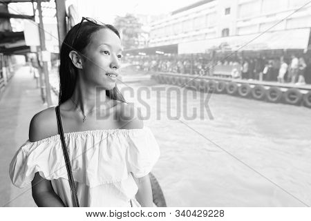 Young Beautiful Tourist Woman Exploring The City Of Bangkok